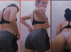 Mulher usando um short de ginástica sexy fazendo uma transmissão ao vivo escondida e se exibindo