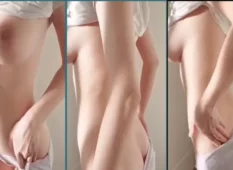 Vídeo X: Uma garota de peitos enormes e pele clara exibindo seu corpo nu